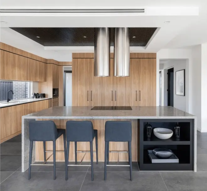 Modern kitchen with a large center island and a breakfast bar overhang.